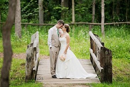 bride and groom on bridge image